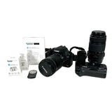 Canon camera with lenses and accessories on a white background