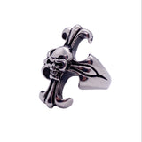 Silver ring with skull and crossbones design on a white background