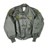 Green bomber jacket with green patches on a white background