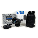 Camera lens with packaging and accessories on a white background