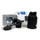 Camera lens with packaging and accessories on a white background