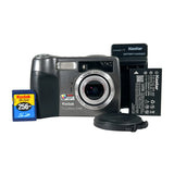 Kodak camera with battery, charger, and memory card on a white background