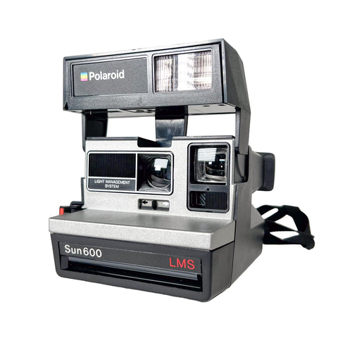 Polaroid Sun 600 camera on a white background