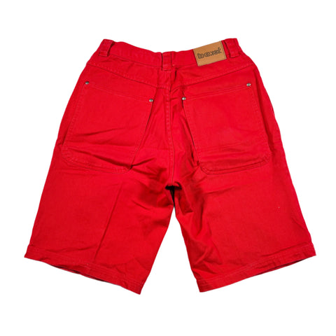 Red shorts with a brand label on a white background