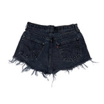 Black denim shorts with frayed edges on a white background