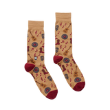 Pair of socks with guitar and music note pattern on a beige background