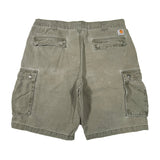 Green cargo shorts on a white background