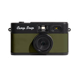 Green camera with 'Camp Snap' branding on a beige background