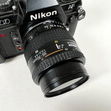 Vintage 1986 Nikon N2020 SLR with AF Nikkor 35–70mm Lens Film Camera