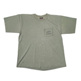 An oversized olive green short-sleeve t-shirt with a chest pocket featuring 'Harley Davidson' printed on it, laid flat on a white surface.