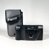 A vintage black Ricoh IR-1000 film camera with its gray ribbed protective case, both showing the Ricoh brand logo, set against a plain white background.