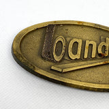 Vintage 90's Bandag Tire Company Brass Logo Belt Buckle