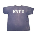 Blue t-shirt with 'KVFD' printed on the back against a white background