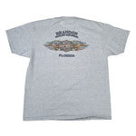 Gray t-shirt with brand logo and text on a white background
