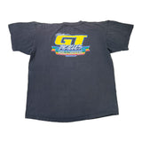 Black t-shirt with colorful graphic on a white surface