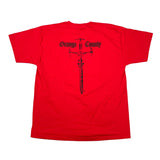 A bright red short-sleeve t-shirt laid flat on a white surface, featuring a black graphic of a sword and the text 'Orange County' in a gothic font across the upper back.