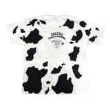 White t-shirt with black cow print pattern on a white background