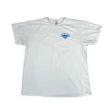 A white short-sleeve t-shirt laid flat on a white fabric background, featuring a small blue graphic on the left chest with the text 'SUNSET CO.' and a mountain silhouette.
