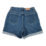 Blue denim shorts on a white background