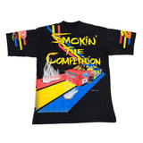 Black t-shirt with colorful graphic design featuring a car and text on a white background