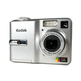 Silver Kodak camera on a white background