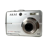 Silver Akai digital camera on a white background
