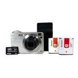 Digital camera with batteries and memory card on a white background