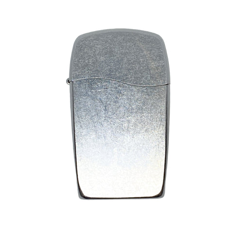 Silver lighter on a textured gray background