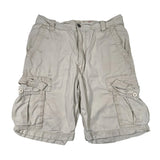 Beige cargo shorts on a white background