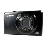 Canon S90 digital camera on a white background