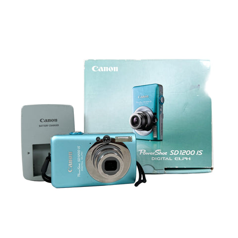 Canon PowerShot SD1200 IS digital camera with packaging on a white background