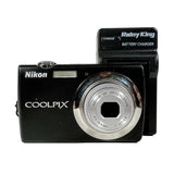Nikon Coolpix camera with a Rainy King battery charger on a white background