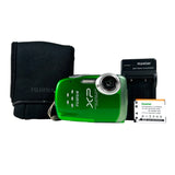 Green Fujifilm camera with battery and charger on a white background