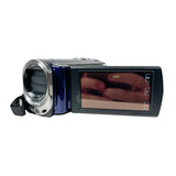 A Sony video camera with a blue and silver body, shown from a side angle against a plain white background. The screen is turned on but displays a reflection of a person's hand, which is excluded from the product's color identity.