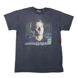A faded black graphic t-shirt featuring a portrait of Lt. Commander Data from the movie Terminator, with green matrix-style code and 'DATA' text on the front, laid flat on a white background.