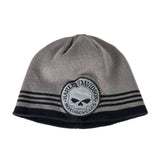 A gray knit beanie hat with a black ribbed cuff, featuring three horizontal black stripes near the top and a circular Harley-Davidson Motorcycles patch on the front.