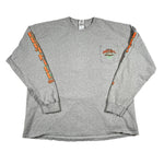 Gray long-sleeve shirt with orange and green designs on sleeves and chest pocket against a white background