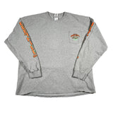 Gray long-sleeve shirt with orange and green designs on sleeves and chest pocket against a white background
