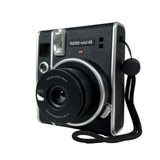 Black Instax mini 40 instant camera on a white background
