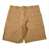 Brown shorts with a visible brand logo on a white background