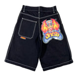 Black shorts with a colorful graphic design on a white background