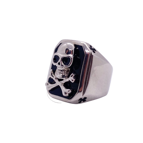 Silver ring with skull design on a white background