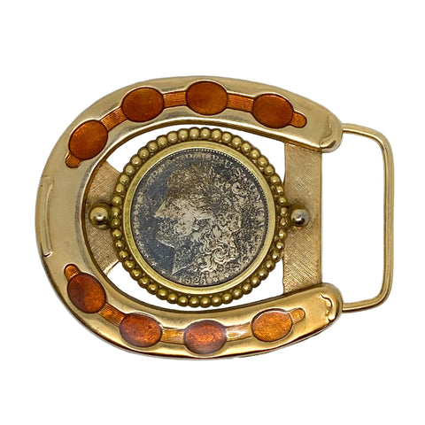 Gold belt buckle with central coin design on a white background