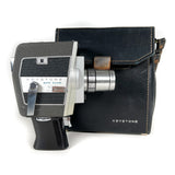 Vintage Keystone movie camera with leather case on a white background