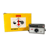 Kodak Instamatic 104 camera with packaging on a white background