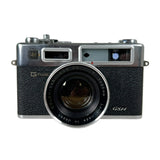 Vintage camera with 'Yashica' branding on a white background