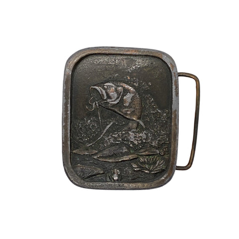 Decorative metal belt buckle with a fish design on a white background