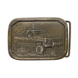 Belt buckle with a truck design on a white background