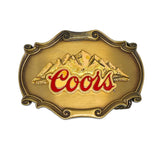 Gold belt buckle with Coors logo on a white background