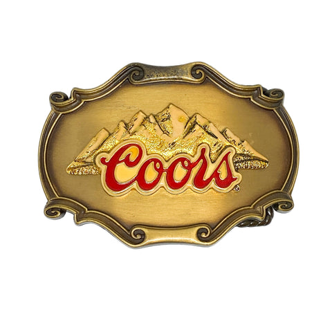 Gold belt buckle with Coors logo on a white background